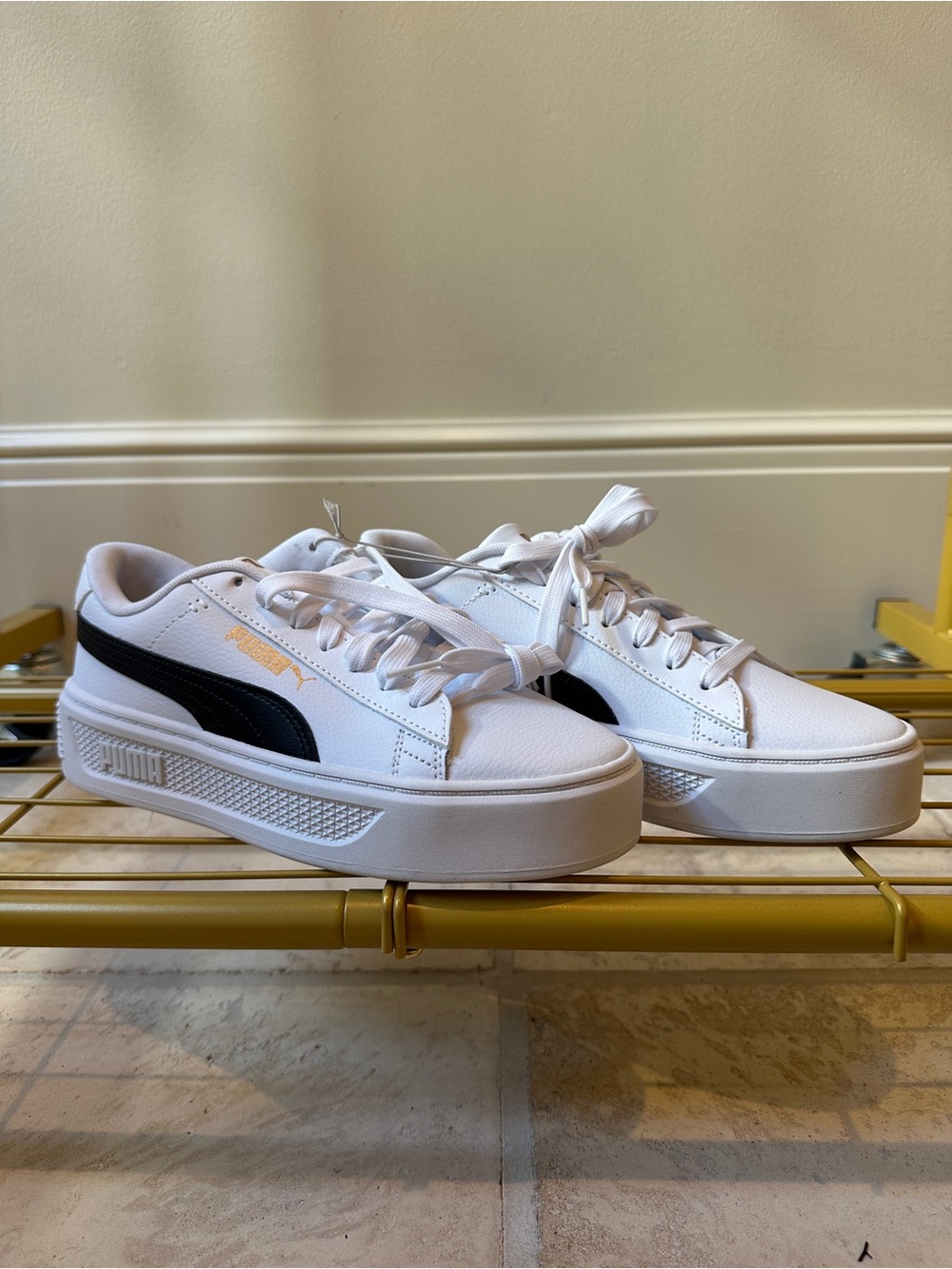 Puma Women’s White Sneakers with Black Formstrip and Gold Logo